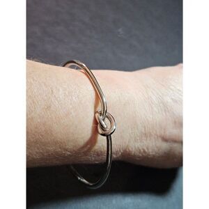 Silver tone knotted cuff bracelet 6.5"